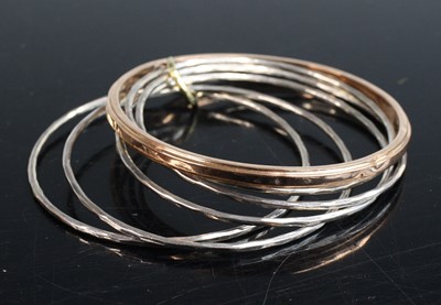 Lot 301 - A 9ct gold hollow bangle, sponsor MC&S,...