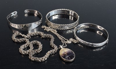 Lot 313 - A silver hinge bangle with safety chain...
