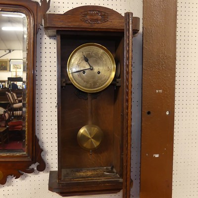 Lot 1120 - An early 20th century oak drop trunk wall...