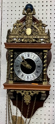 Lot 1125 - A Swiss walnut and brass mounted wall clock