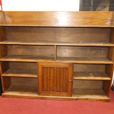 Lot 1136 - A joined oak freestanding open bookshelf,...