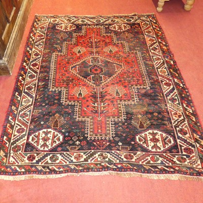 Lot 1137 - A Persian woollen red and blue ground Hamadan...