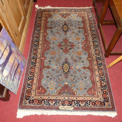 Lot 1139 - An Afghan sky blue woollen Ziegler rug, signed...