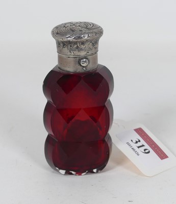 Lot 319 - A white metal capped faceted cranberry glass...