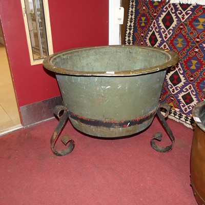 Lot 1154 - A large copper log bucket, housed in a black...