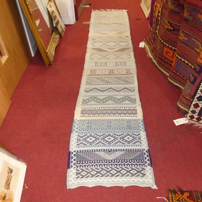 Lot 1158 - A pastel ground Kilim hall runner, 305 x 63cm