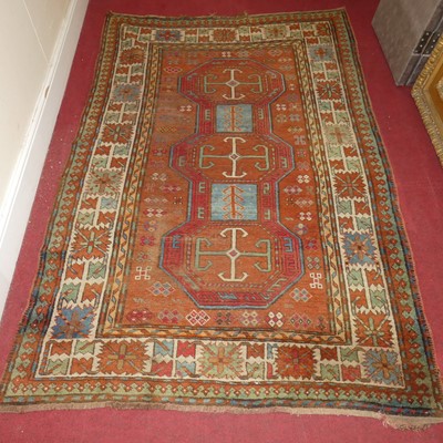 Lot 1159 - A Persian woollen red ground Kazak rug, 198 x...