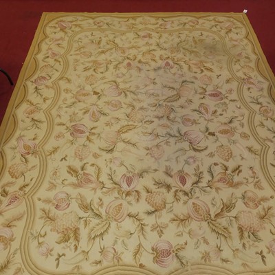 Lot 1160 - A machine woven Aubusson beige ground floral...