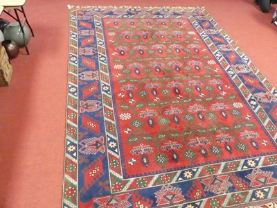 Lot 1161 - A Persian woollen blue, red and cream ground...
