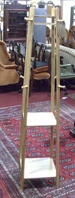 Lot 1168 - A contemporary rubberwood freestanding coat...