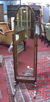 Lot 1171 - A 1920s figured walnut cheval mirror, the...
