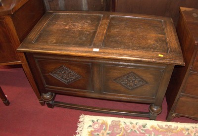 Lot 1182 - A joined oak two-panelled hinge top blanket...
