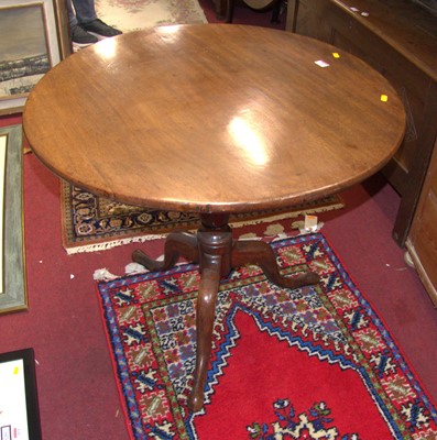Lot 1189 - A George III mahogany circular tilt-top...