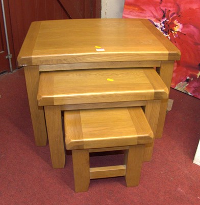 Lot 1195 - A contemporary blond oak nest of three...