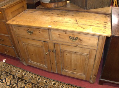 Lot 1196 - A 19th century pine dresser base, having twin...