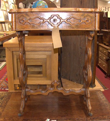 Lot 1197 - A mid-19th century figured walnut and shaped...