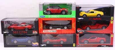Lot 563 - Eight 1:18 scale diecast cars to include a...