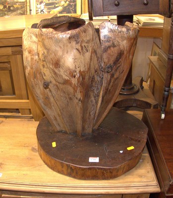Lot 1200 - A stained root wood stick stand, raised on a...