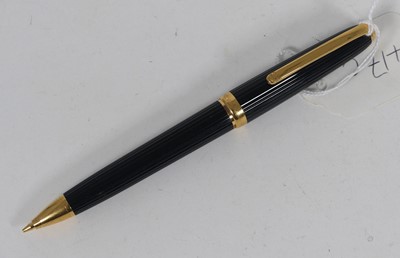 Lot 417c - A Cartier mechanical pencil, in ribbed black...