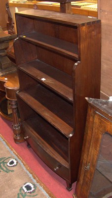 Lot 1212 - A hardwood waterfall bookshelf, having single...