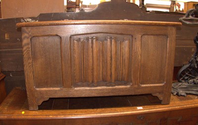 Lot 1219 - A linenfold oak hinge top blanket chest, width...