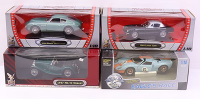 Lot 561 - Four 1:18 scale diecast model cars to include...