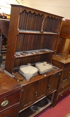 Lot 1228 - An oak compact dresser, having two-tier open...