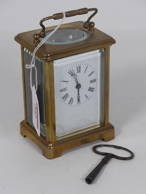 Lot 342 - A French lacquered brass cased carriage clock,...