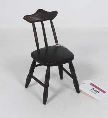 Lot 346 - An early 20th century doll's house stickback...