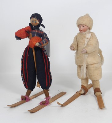 Lot 355 - A porcelain headed doll, modelled skiing,...