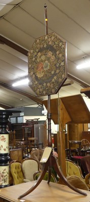 Lot 1238 - A Regency ring turned mahogany pole screen,...