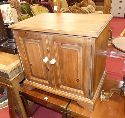 Lot 1239 - A small modern pine low double door side...