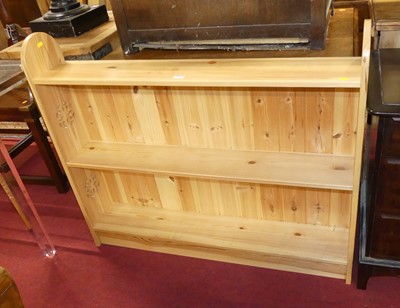 Lot 1245 - A modern pine low two-tier open bookshelf,...