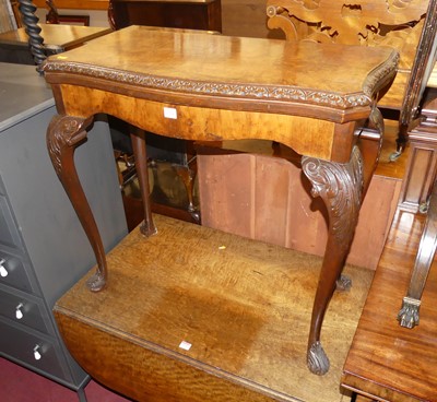 Lot 1254 - A 1930s figured walnut and floral relief...