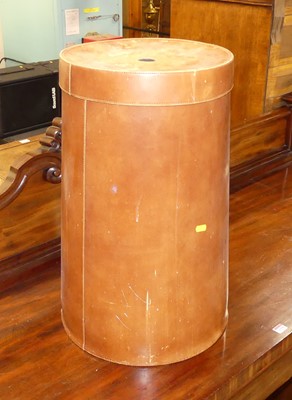 Lot 1259 - A stitched tan leather circular laundry box...
