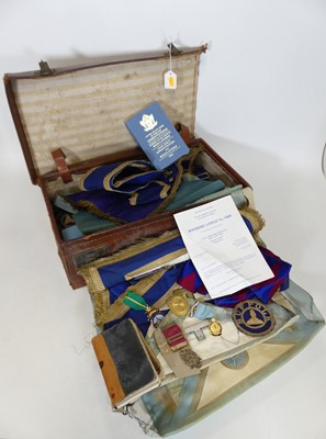 Lot 498 - A leather suitcase containing a quantity of...