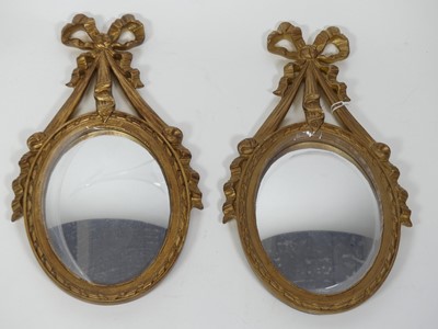 Lot 442 - A pair of reproduction gilt composite wall...