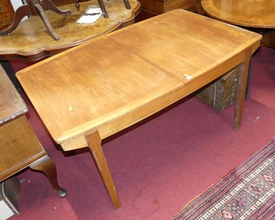 Lot 1274 - A 1960s teak extending dining table, having...