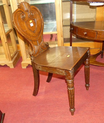 Lot 1283 - A Regency mahogany shield back panel seat...