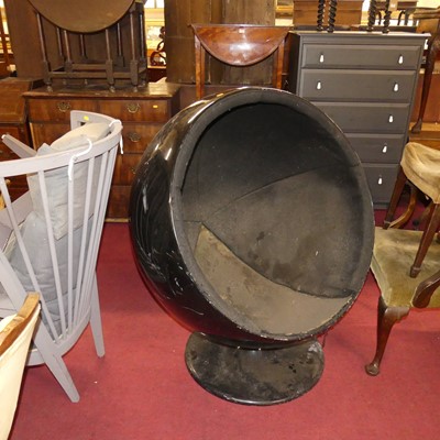 Lot 1310 - After Eero Aarnio, a black lacquered...