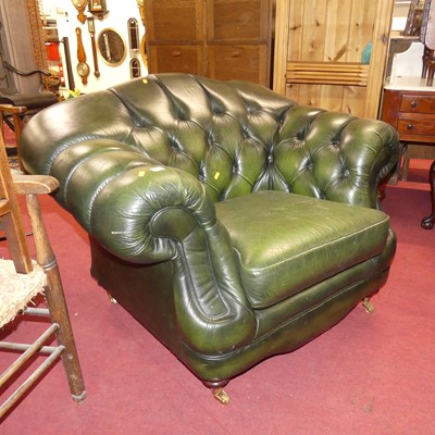 Lot 1314 - A contemporary green leather button back...