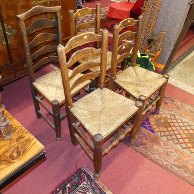 Lot 1348 - Four early 20th century elm and rush seat...