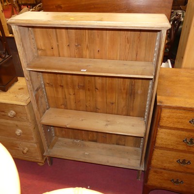 Lot 1352 - A rustic pine freestanding open bookshelf with...