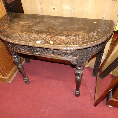 Lot 1361 - A circa 1900 relief carved oak D-shaped single...