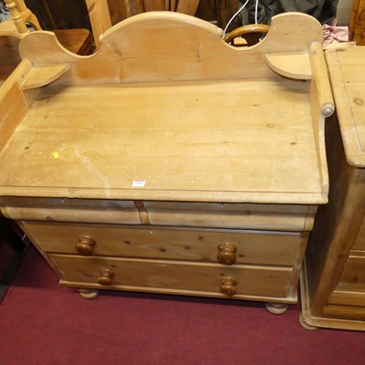 Lot 1365 - A Victorian pine scroll three-quarter gallery...