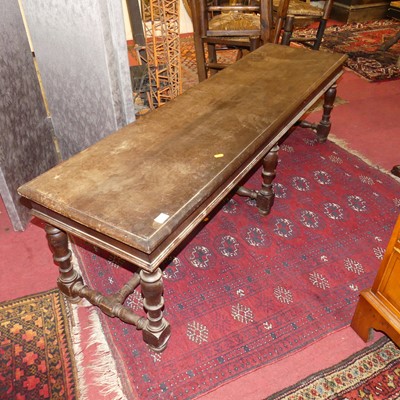 Lot 1368 - An early 20th century walnut long bench,...