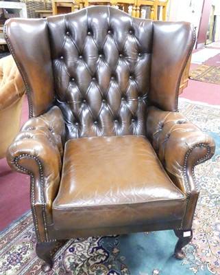 Lot 1372 - A contemporary cognac brown leather buttoned...
