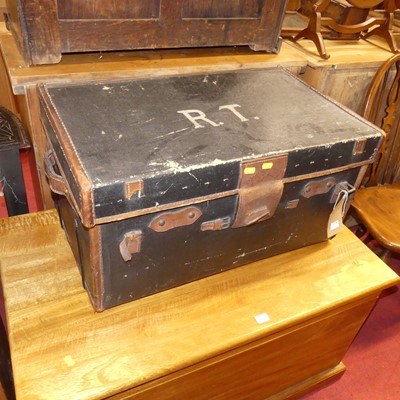 Lot 1378 - A canvas and tan leather bound hinge top...
