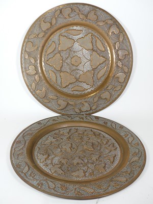 Lot 380 - A near pair of Kashmiri brass trays, each with...