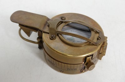 Lot 410 - A reproduction military style brass cased compass